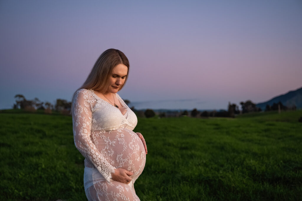 blue hour maternity image lady in white dress